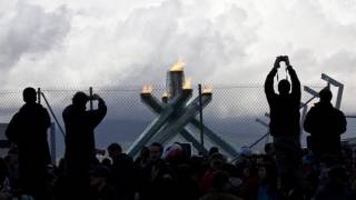 Olympic Flame Behind Bars