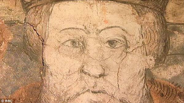 Out with his head! Couple uncover medieval mural of King Henry VIII