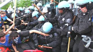 Protesters and Police Clash at NATO Meeting; 2 Held on Terrorism Charges