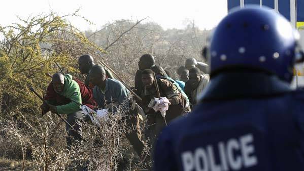 South Africa police defend shooting 34 miners