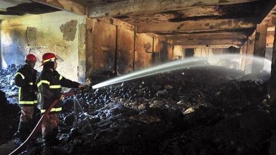 Bangladesh: At least 112 killed as fire races through garment factory