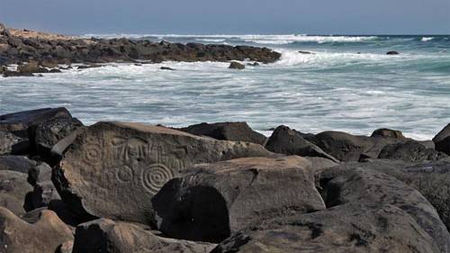 Who created Las Labradas petroglyphs?