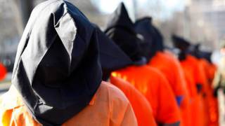 Obama signs Pentagon bill maintaining Guantanamo and military detention