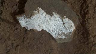 Curiosity breaks rock to reveal dazzling white interior