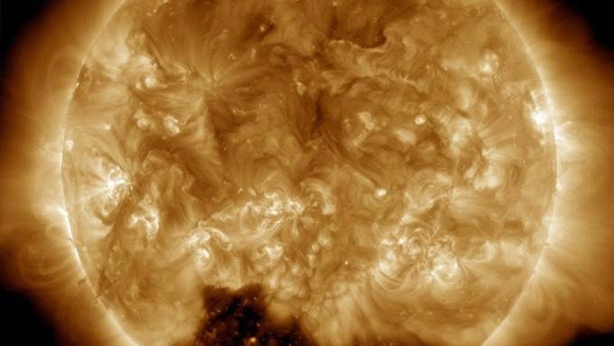 Mystery at the sun's south pole: Nasa reveals huge 'coronal hole' on the solar surface where winds reach 500 miles per SECOND