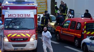 Police officer shot dead outside Paris, suspect at large