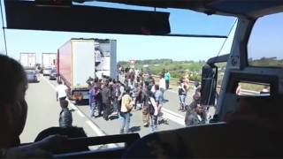 Rioting Migrants Attempt to Hijack Trucks Heading for UK