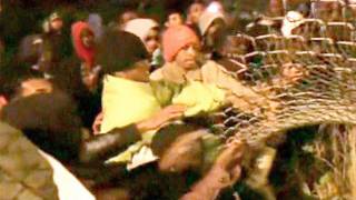 "Open the border - we're going to the UK!" Chanting mob of 200 storm Eurotunnel