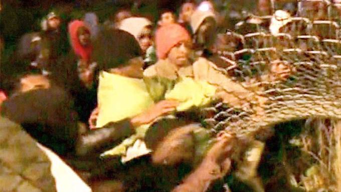 "Open the border - we're going to the UK!" Chanting mob of 200 storm Eurotunnel