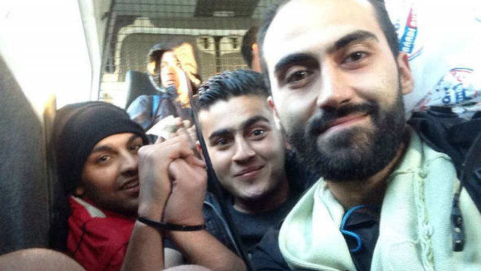 'We made it!’ Migrants grin for selfie as they boast of how easy it is to enter Germany