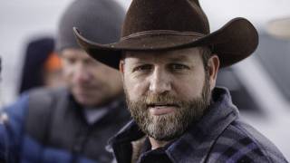 Oregon militia member is shot dead as routine traffic stop escalates into shoot-out with the FBI that ends with leader Ammon Bundy arrested and his brother Ryan wounded